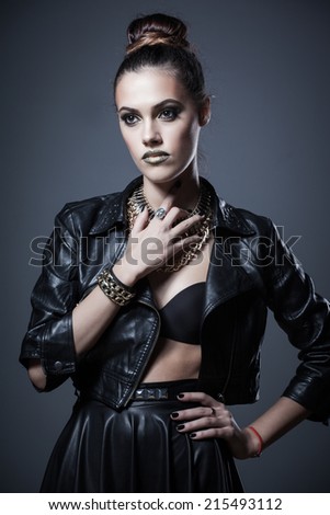 Gorgeous beautiful sexy woman in a leather clothes