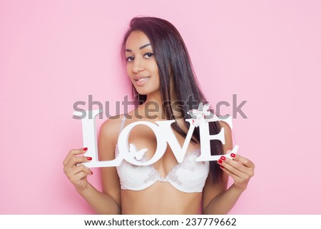 fashion young African woman in white lingerie with the words \