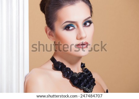 Gorgeous Fashion Model in Ceremonial Shiny Dress with beautiful make-up