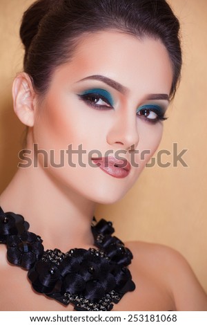 Gorgeous Fashion Model in Ceremonial Shiny Dress with beautiful make-up