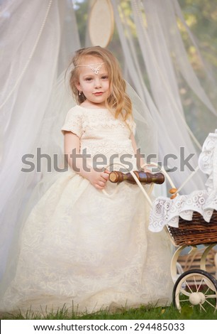 Outdoor portrait of cute little girl in princess dress