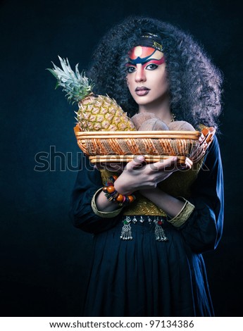 beautiful African woman with a basket of fruit