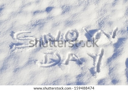 Snow Day Written In Capital Letters In Fresh Snowfall Signifies No School