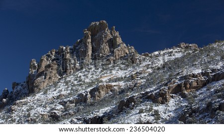 Catalina Mountains slope dusted with snow, viewed from a Mount Lemmon vista, high above the Sonoran desert of Tucson, Arizona, in America\'s Southwest;