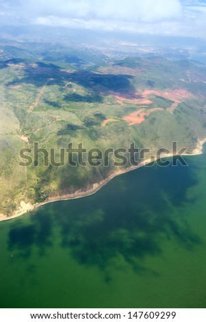 Green island with blue sky  and sea from plan aerial view