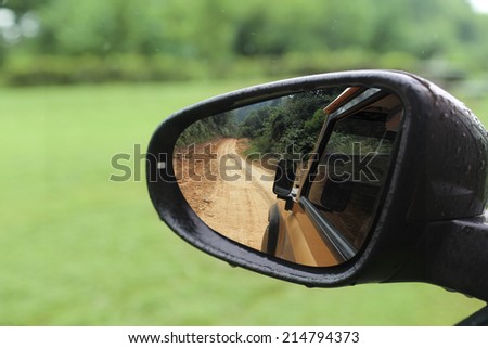 rough road in rear mirror show adventure