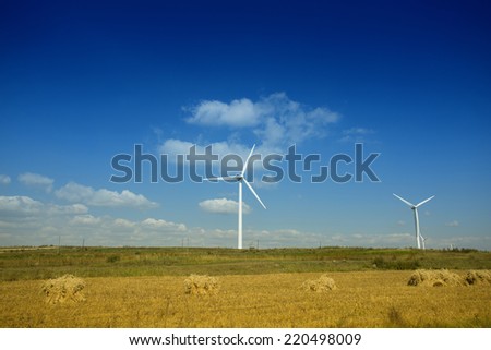 Wind farm at farmland against blue sky,north China