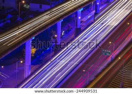 shanghai city traffic in night with car lamp track