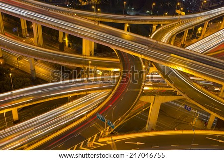 Night skyline view of Shanghai city and highways with flowing traffic