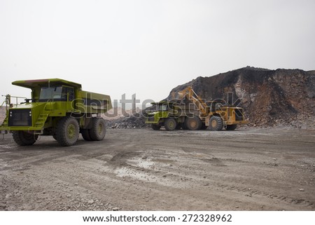 Heavy Dump truck working at mining site,China
