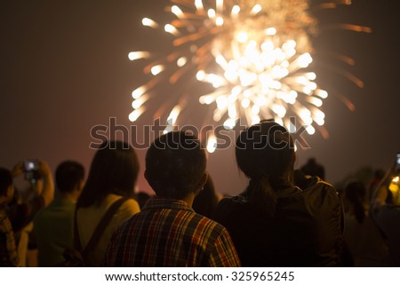 Fireworks with silhouettes of people in a holiday events,Shanghai