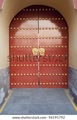 traditional Chinese red door at Temple of Heaven in Beijing which is one of the landmark of Beijing