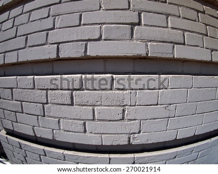 Wall from gray bricks close up with wide angle fisheye lens view