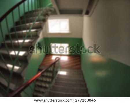 Defocused and blurry image of internal staircase between floors with wide angle distortion view