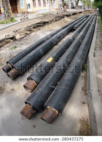 The trench in the streets of the city and new pipes for pipeline repair and replacement with wide angle distortion view