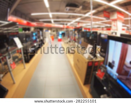 Defocused and blur image of a shop selling household appliances with wide angle distortion view was blurred for use as a background