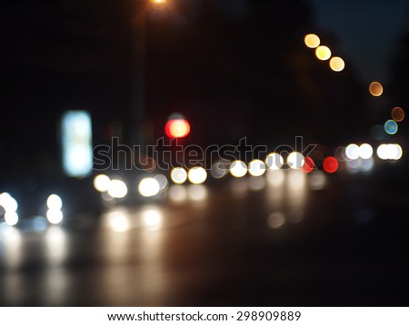 Night scene - defocused car, the lights from the headlights and tail lights of cars on the road was blurred for use as a background