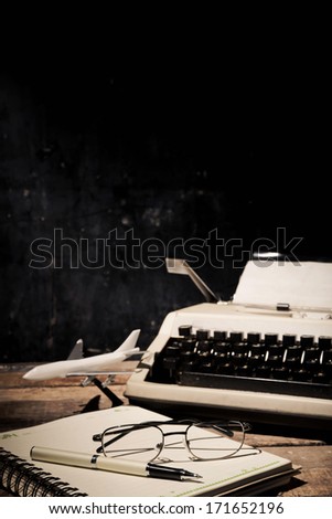 Vintage typewriter and old books