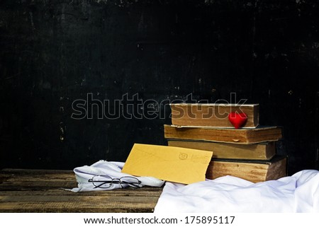 Old book and letters  on wooden background