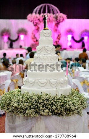 a multi level white wedding cake