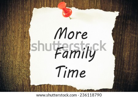 more family time reminder note against grained weathered wood