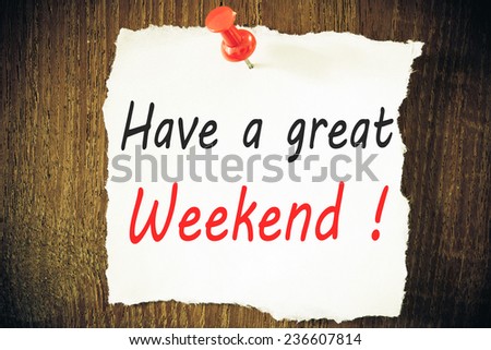 Have a great Weekend - Hand writing text on a piece of paper on wood background