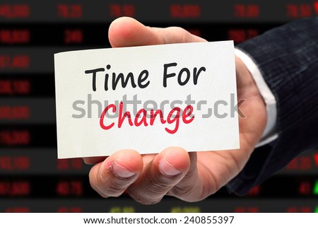 businessman hand writing text time for change