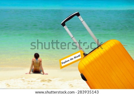 Explore the World. Suitcase with label at sea.