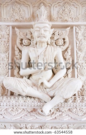 White sculpture hermit statue,old Thai traditional build statues around Buddha  platform to protect Buddha