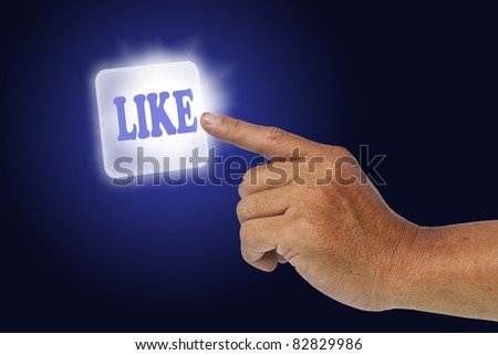 Hand press button like on dark blue background