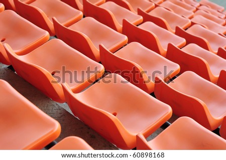 orange chair seats in an empty Stadium Seats , stand