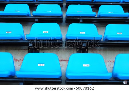 blue chair seats in an empty Stadium Seats , stand