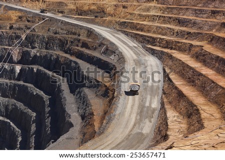 Two trucks transport gold ore from open cast mine. Barrick Cowal Gold Mine in New South Wales,  Australia.