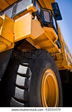Large yellow truck used in modern Gold Mine in Kalgoorlie, Western Australia. Truck transports gold ore from the Super Pit, Open cast mine.