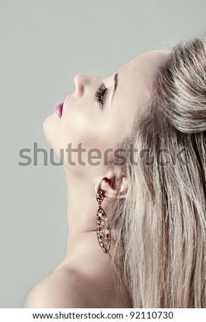 Beautiful blond woman with earrings