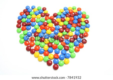 stock photo : Chocolate Lollies Arranged in Heart Shape on White Background