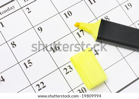 Close Up of Yellow Marker Pen on Calendar