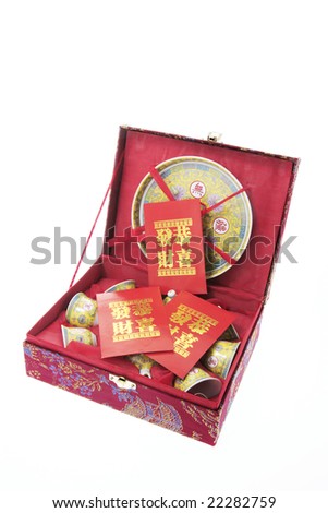 Chinese Tea Set and Red Packets on White Background