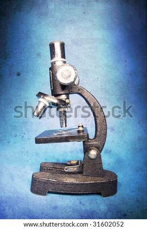 Microscope in Grunge Style on Blue Background