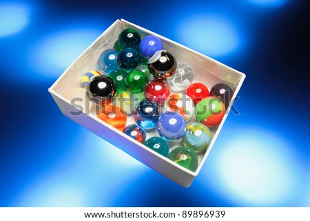 Glass Marbles in Box with Blue Glows
