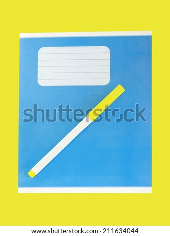Blue writing book and pen on a yellow background.