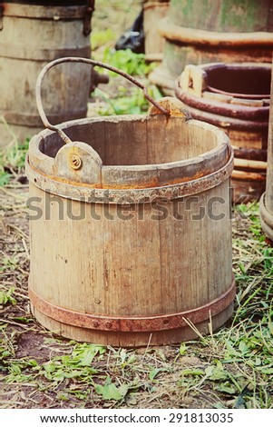 Old wooden bucket taken closeup.Toned image.