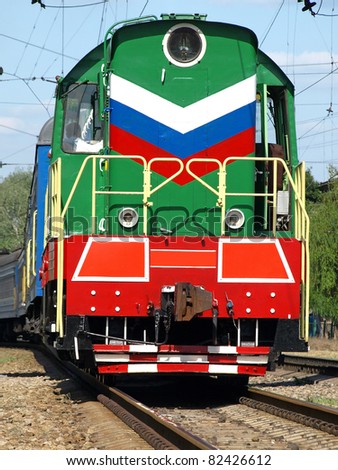 Multicolored locomotive on the rails.