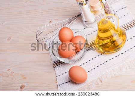 brown eggs with spices on a light wooden table top view and side view