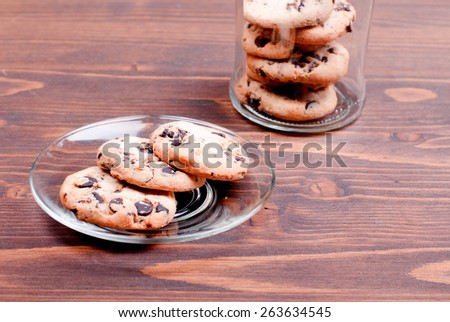 Delicious chocolate chip cookies on  board top view