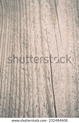 wooden plank with splinters and cracks. Vintage photography effect.