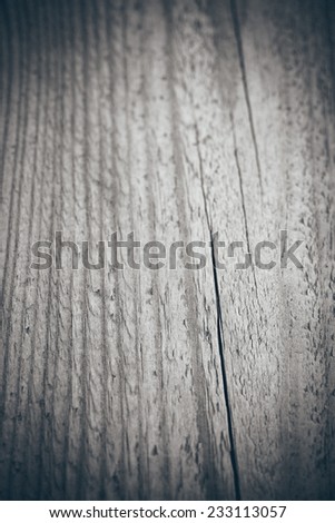 wooden plank with splinters and cracks. Vintage photography effect. Retro grainy color film look.