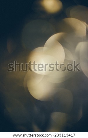 Abstract Festive background. Christmas and New Year feast bokeh background with copyspace. Holiday party background with blurry boke special magic effect. Retro grainy color film look.
