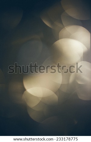 Abstract Festive background. Christmas and New Year feast bokeh background with copyspace. Holiday party background.Vintage photography effect. Retro grainy color film look.