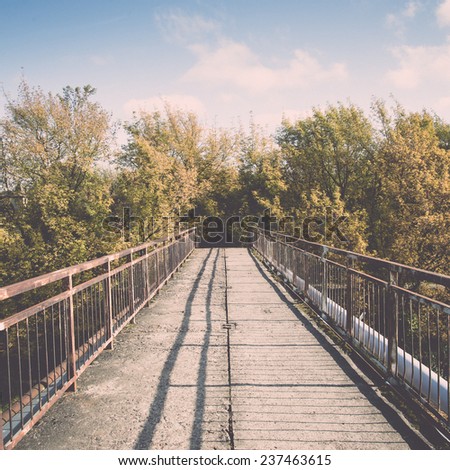 old bridge with rusty metal rails near sea port - retro, vintage style look